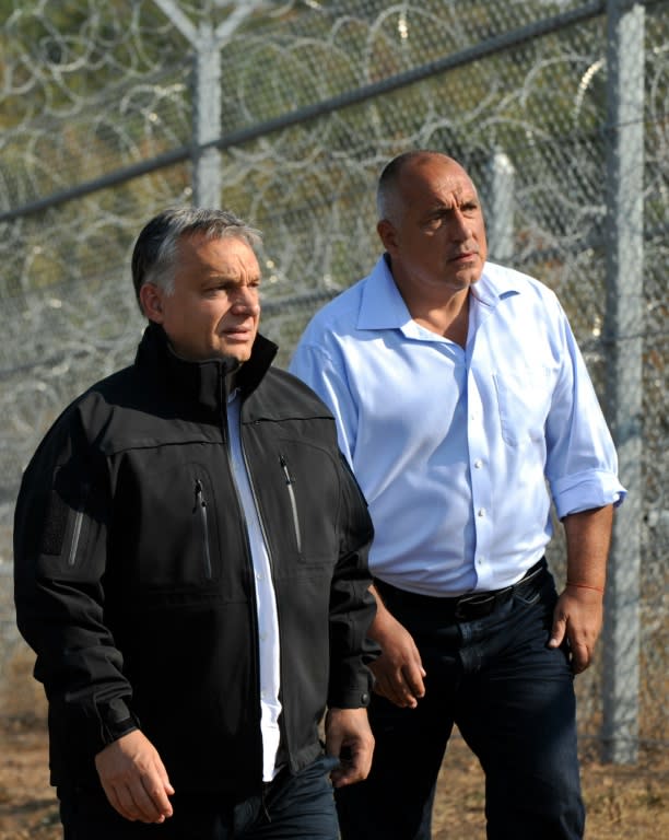 Hungary's Prime Minister Viktor Orban (L) and Bulgaria's Prime Minister Boyko Borisov tour the area where a fence was erected on the Bulgaria-Turkey border near the town of Lesovo, on September 14, 2016