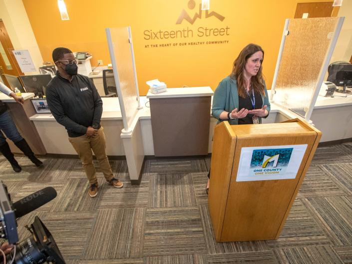 Andrea Nauer Waldschmidt, right, Psychiatric Crisis Service coordinator and co-chair of Prevent Suicide of Greater Milwaukee, speaks next to Milwaukee County Executive David Crowley, left, during a news conference on Wednesday, March 30, 2022, stressing the importance of community resources for suicide prevention at the Sixteenth Street Clinic in Milwaukee.