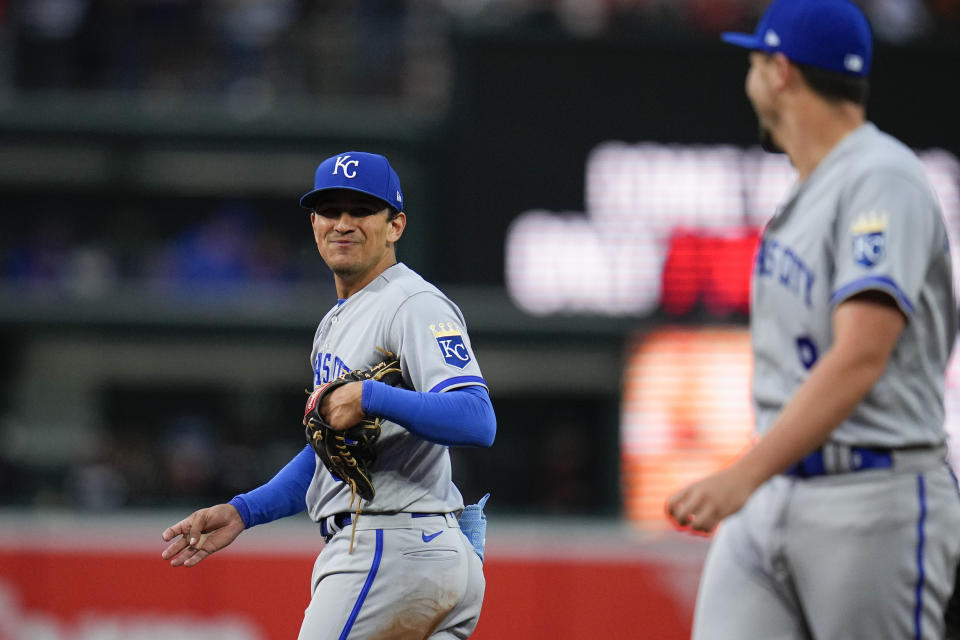 Kansas City Royals second baseman Nicky Lopez, left, talks with first baseman Vinnie Pasquantino during the third inning of a baseball game against the Baltimore Orioles, Friday, June 9, 2023, in Baltimore. (AP Photo/Julio Cortez)