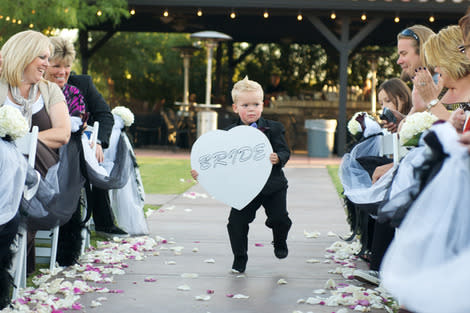 Pillow boy carrying sign.