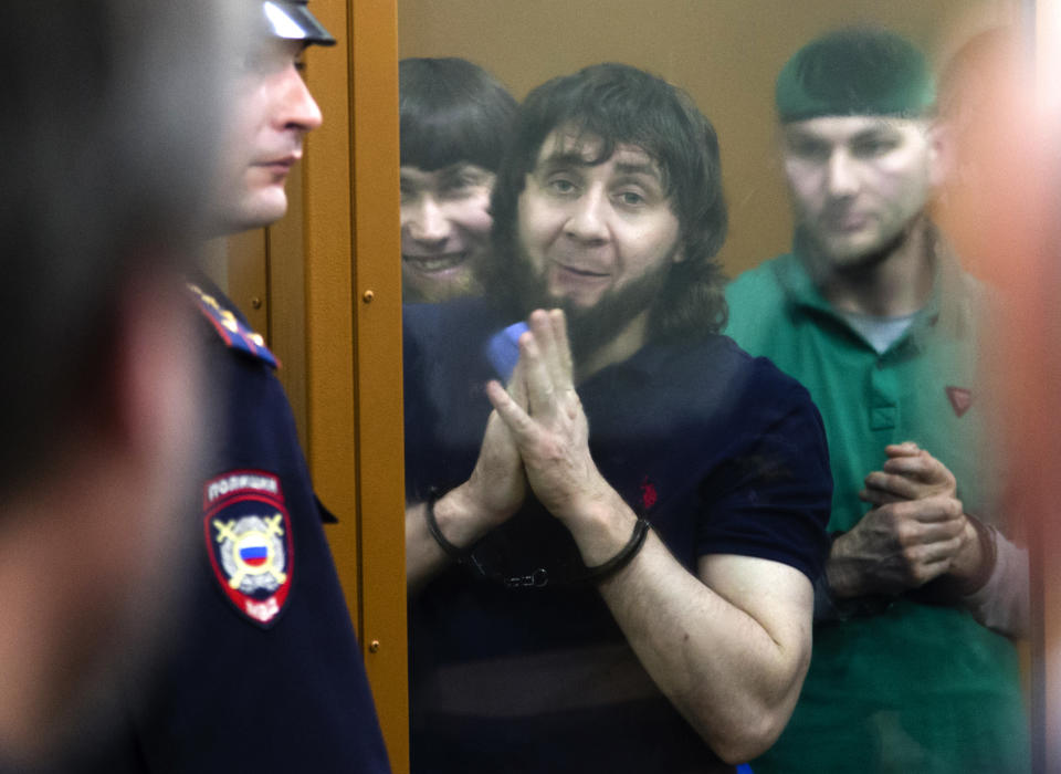 FILE In this file photo taken on Thursday, July 13, 2017, Zaur Dadayev, center left, Anzor Gubashev, center, and Shadid Gubashev, center right, listen to the sentence in a court room in Moscow, Russia. Zaur Dadayev, convicted in the 2015 assassination of leading opposition figure Boris Nemtsov. A hunger strike by jailed Russian opposition leader Alexei Navalny cast a spotlight on the country’s prison system that critics say is built on fear and torment. Navalny was transferred Sunday, April 18, 2021 from his prison colony to a hospital in another prison amid reports about his declining health that drew international outrage. Nearly 520,000 inmates occupy Russia’s prison system - numerically by far the largest prison population in Europe. Most of the prisons are collective colonies, a system dating back to the Soviet Gulag era, with workshops and inmates sleeping in dormitories. (AP Photo/Ivan Sekretarev, File)