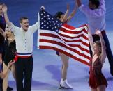 United States men's and women's singles Olympic figure skating team members Jeremy Abbott (L) and Ashley Wagner wave to the crowd at an exhibition event at the conclusion of the U.S. Figure Skating Championships in Boston, Massachusetts January 12, 2014. REUTERS/Brian Snyder