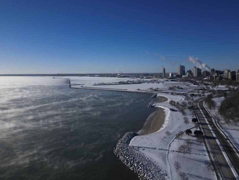 With temperatures below zero, steam rises over Lake Michigan Tuesday, Jan. 16, 2024, in Milwaukee. (AP Photo/Morry Gash)