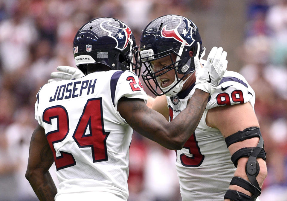 Houston Texans defensive end J.J. Watt (99) celebrates with defensive back Johnathan Joseph (24) after sacking New York Giants quarterback Eli Manning during the first half of an NFL football game Sunday, Sept. 23, 2018, in Houston. (AP Photo/Eric Christian Smith)