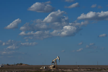 A pump jack operates in the Permian Basin oil and natural gas production area near Midland, Texas U.S. August 23, 2018. Picture taken August 23, 2018. REUTERS/Nick Oxford