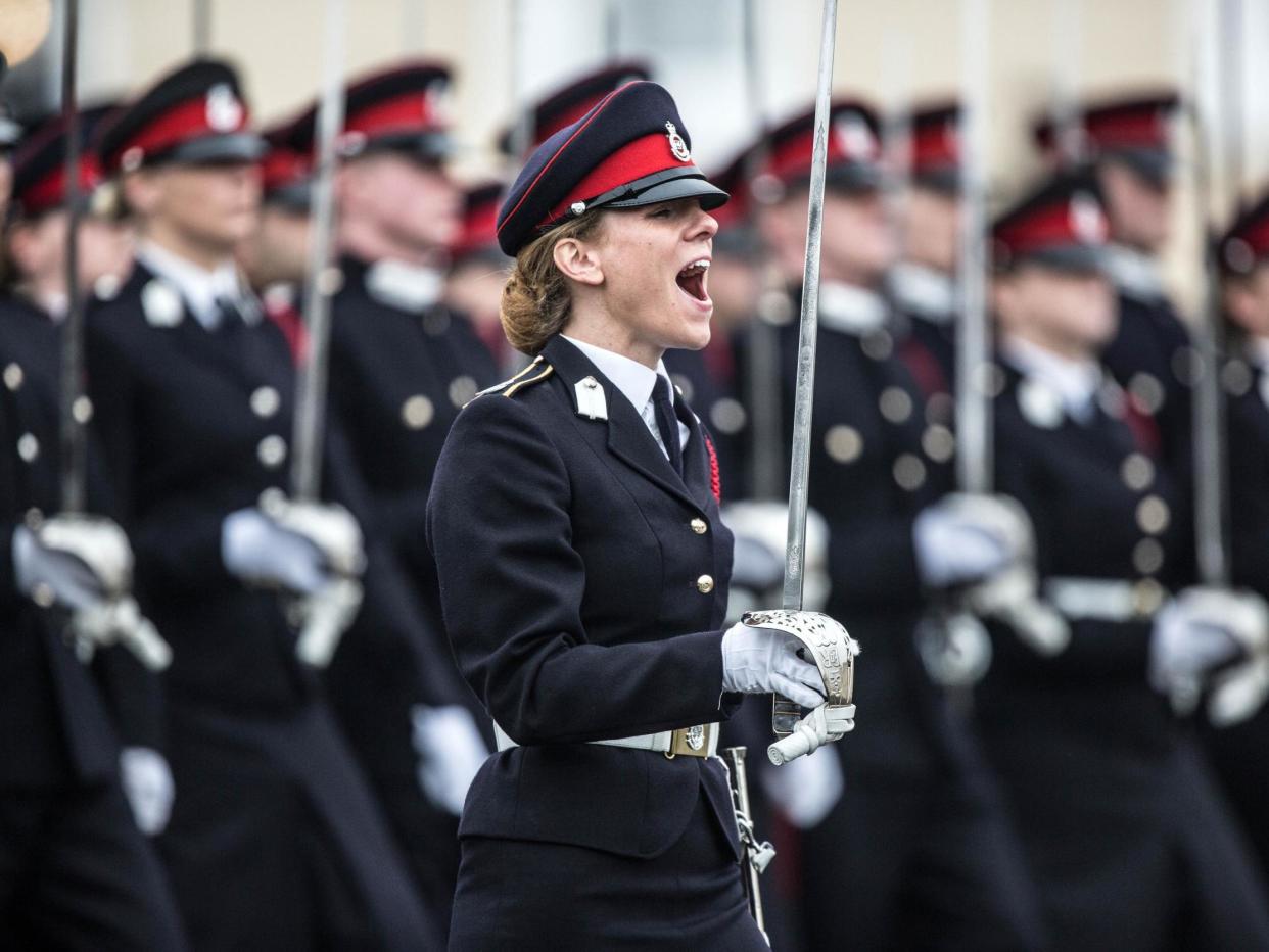 British Army officer Captain Rosie Wild shouts commands during the Officer Cadets march at Sandhurst after receiving the Sword of Honour, 16 December, 2016: Richard Pohle - Pool / Getty Images