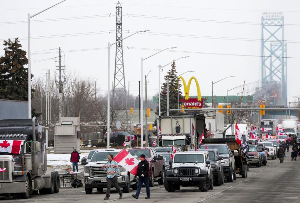 Truckers and supporters block the access leading from the Ambassador Bridge, linking Detroit and Windsor, as truckers and their supporters continue to protest against COVID-19 vaccine mandates and restrictions, in Windsor, Ontario, on Thursday.
