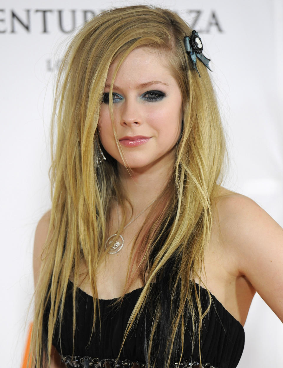 FILE - - In this May 7, 2010 file photo, actress Avril Lavigne arrives at the Race to Erase MS Gala in Los Angeles. Genealogists at Ancestry.com say they’ve discovered teen idol Justin Bieber is a distant cousin of movie star Ryan Gosling and singer Avril Lavigne. Their family link dates back to some of Quebec’s earliest settlers 400 years ago, the Utah-based company said Thursday (AP Photo/Dan Steinberg, file)