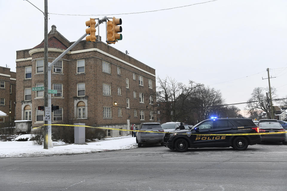 Detroit Police, Michigan State Police and ATF agents work the scene at West McNichols and Log Cabin in Detroit on the border of Highland Park, Mich. on Thursday, Feb. 2, 2023. Authorities searching for three aspiring rappers who have been missing for nearly two weeks have found “multiple bodies” at a vacant Detroit-area apartment building. (Robin Buckson/Detroit News via AP)