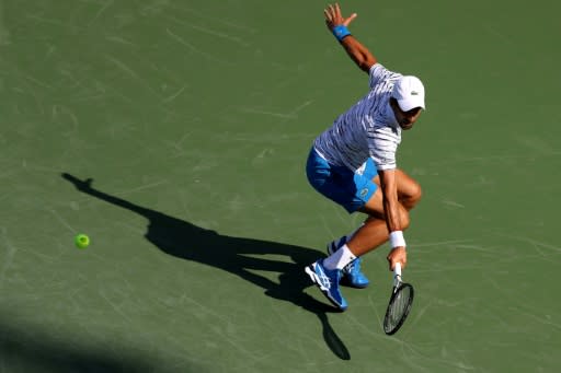 World number one Novak Djokovic of Serbia opens his Cincinnati Masters title defense with a straight-sets win over American Sam Querrey