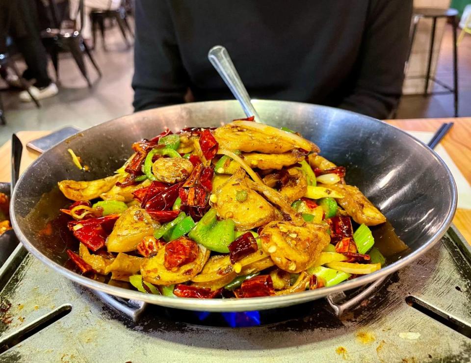 Hunan Style is known for spicy dishes, such as this griddle-cooked pig intestine with peppers.