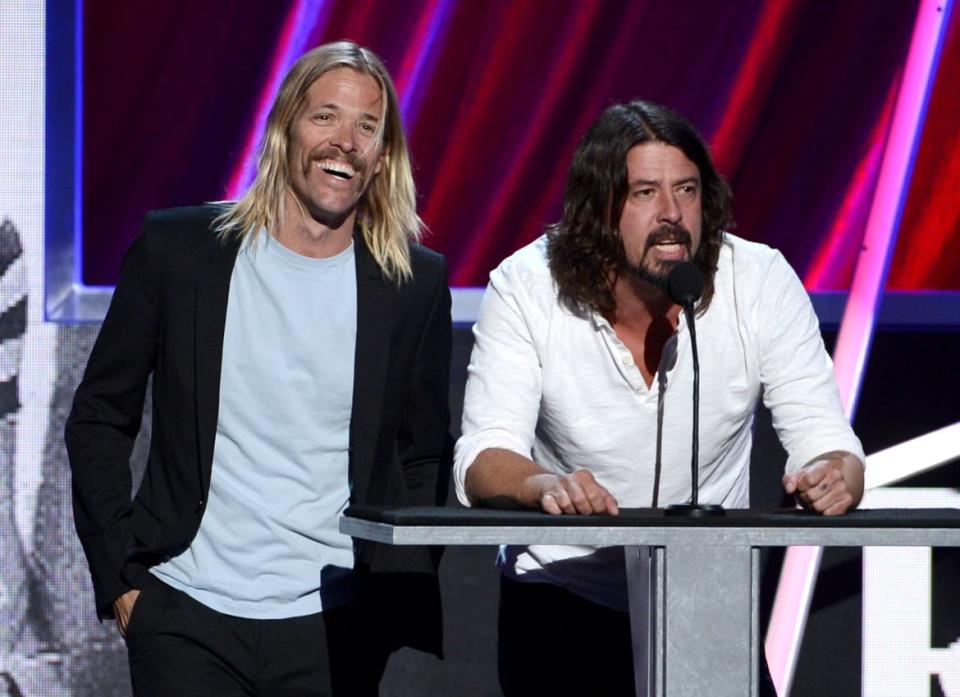 <div class="inline-image__title">166958754</div> <div class="inline-image__caption"><p>Taylor Hawkins and Dave Grohl of Foo Fighters speak on stage at the 28th Annual Rock and Roll Hall of Fame Induction Ceremony in 2013.</p></div> <div class="inline-image__credit">Kevin Winter</div>