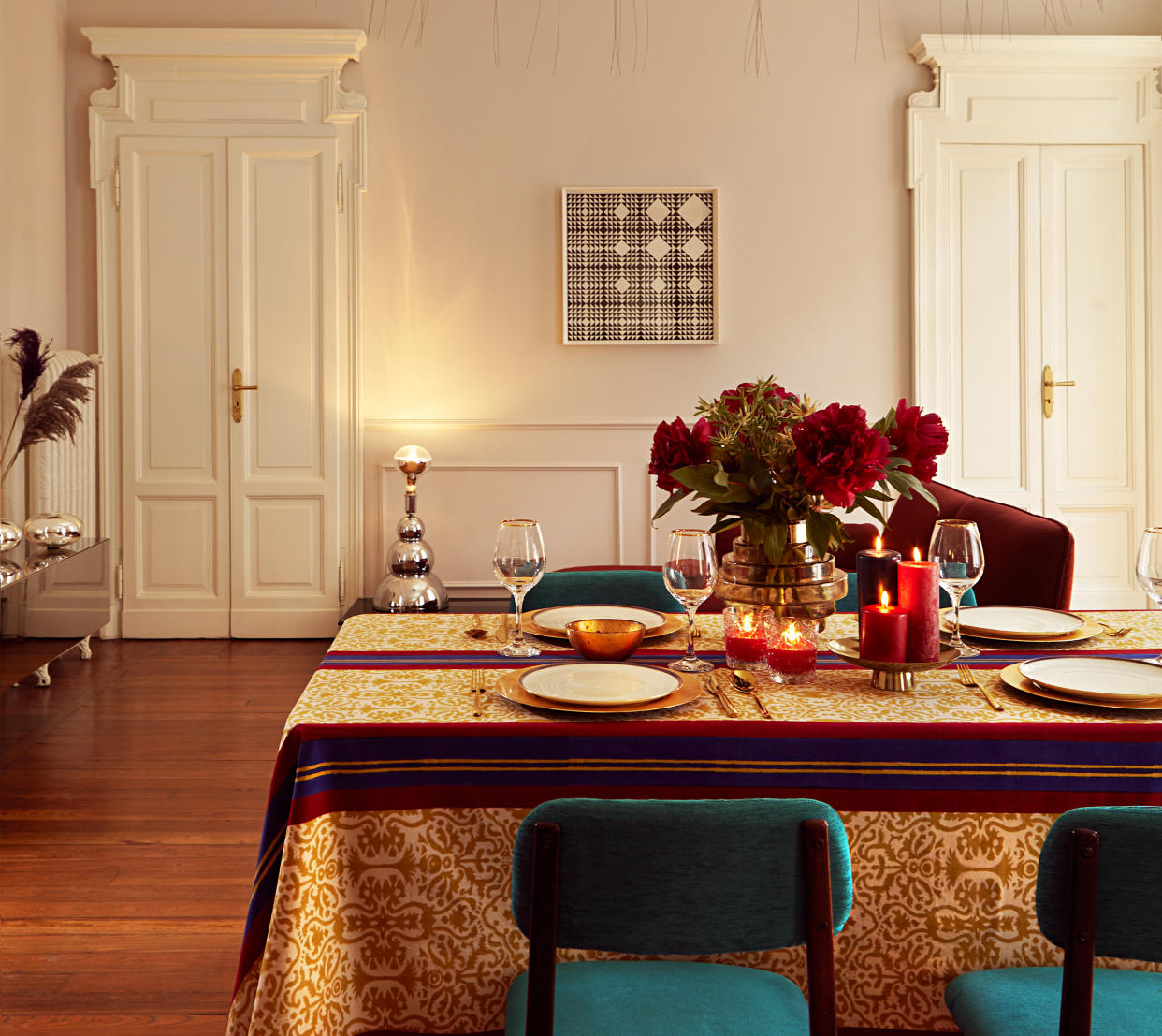  A tablescape with plates laid at the table. 