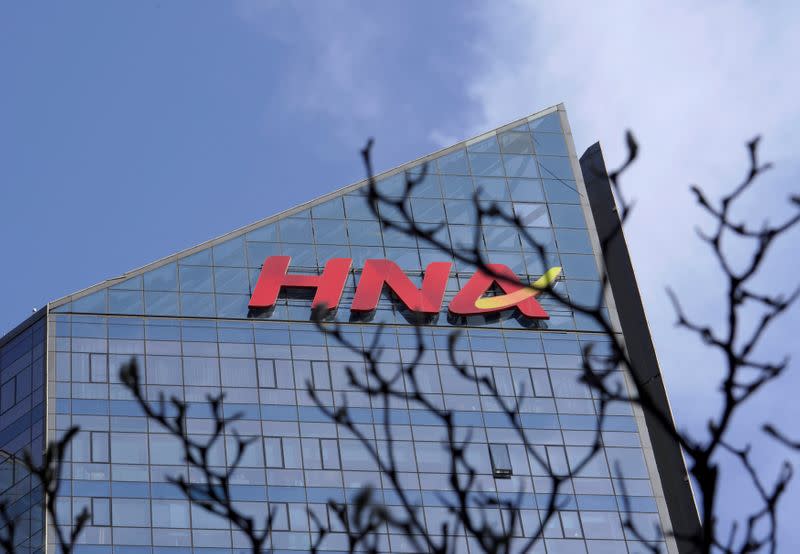 FILE PHOTO: A HNA Group logo is seen on the building of HNA Plaza in Beijing