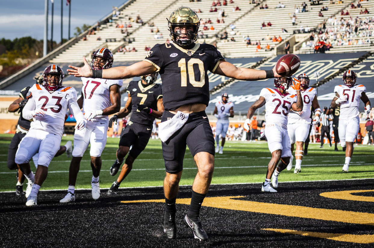 Wake Forest sophomore quarterback Sam Hartman (10) celebrates after scoring a touchdown during an NCAA college football game against Virginia Tech on Saturday, Oct. 24, 2020 at Truist Field in Winston-Salem, N.C. (Andrew Dye/The Winston-Salem Journal via AP)