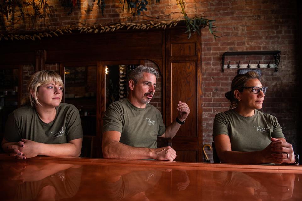 Autumn Brown, left, Dave Madden, center, and Anna Madden, right, talk about the new fare at Piccolo Cucina e Vino in Middletown on Tuesday, June 28.