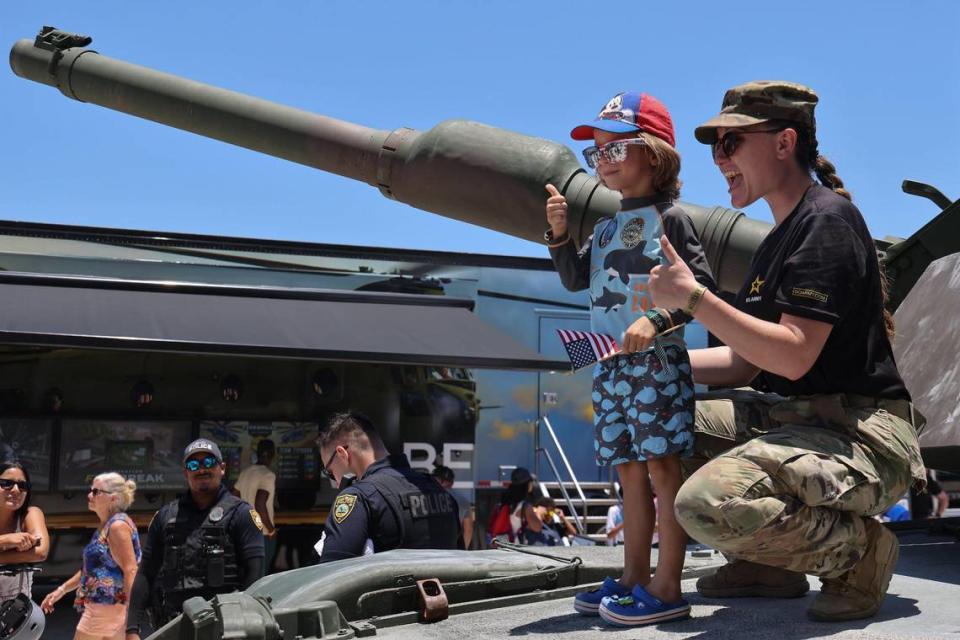 Liam Arias, 4, gives the thumbs up as his mother takes a photo on her cellphone while he stands on the U.S. Army’s M-1 tank. On Sunday, May 28, 2023 the Hyundai Air & Sea Show returned to Miami Beach on Memorial Day Weekend (May 27, 2023 and May 28, 2023.) The event showcases the men, women, technology, and equipment from all five branches of the United States military as well as local police, firefighters, and their first responder agencies. The four block long Display Village that contains a Kid Zone, flight and navigation simulators, tactical training equipment, rifle range simulators, interactive displays from all five branches of the U.S. Military and the Monster Energy Action Zone which showcases a one-of-a-kind action-packed motocross performance by Keith Sayer’s FMX (Freestyle Motocross) demonstration team.