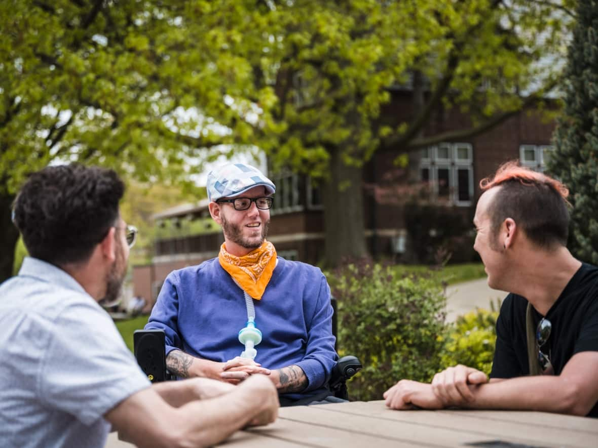 Ian MacPherson, centre, is running for a council seat in Hamilton's Ward 1 in the 2022 municipal election.  (David Coulson/Submitted - image credit)