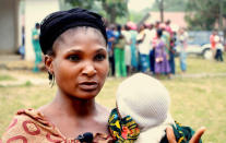 A still image taken from a video shot on December 9, 2017 shows Cameroonian refugee Eta Quinta, 32, holding her baby during an interview with Reuters in Agbokim Waterfalls village, which borders on Cameroon, Nigeria. REUTERS/via Reuters TV