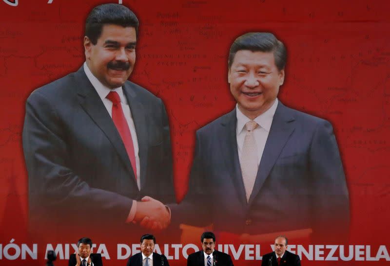 FILE PHOTO: China's President Xi and Venezuela's President Maduro attend a signing ceremony in Caracas