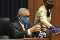 Rep. Bobby Scott, D-Va., puts a cloth cover over his microphone during a House Committee on Education and Labor Subcommittee on Workforce Protections hearing examining the federal government's actions to protect workers from COVID-19, Thursday, May 28, 2020 on Capitol Hill in Washington. (Chip Somodevilla/Pool via AP)