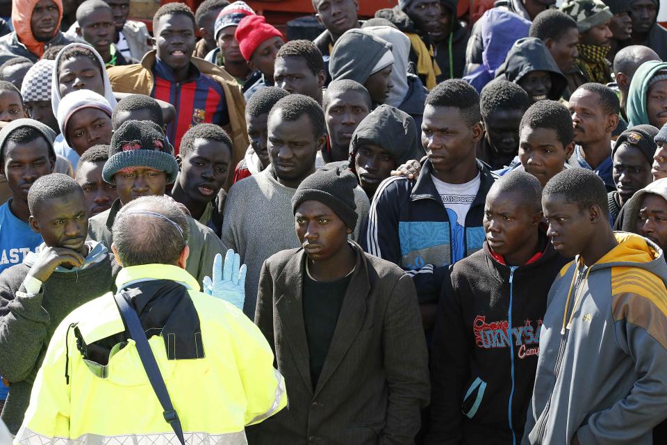 Migrants arrive at the Sicilian harbour of Pozzallo