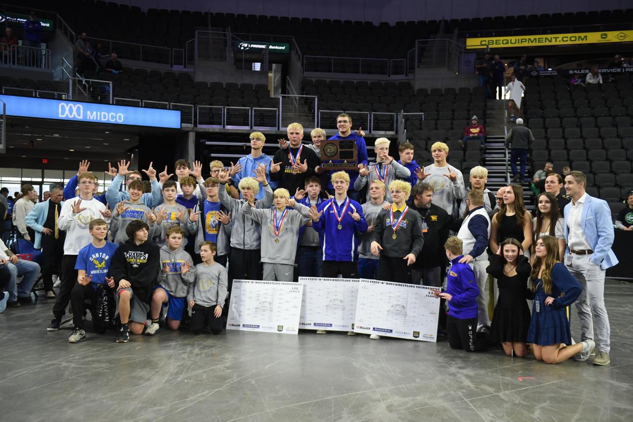 The Canton boy's wrestling team poses for their 7th consecutive state title win on Saturday, Feb. 24, 2024 at the Denny Sanford Premier Center in Sioux Falls.