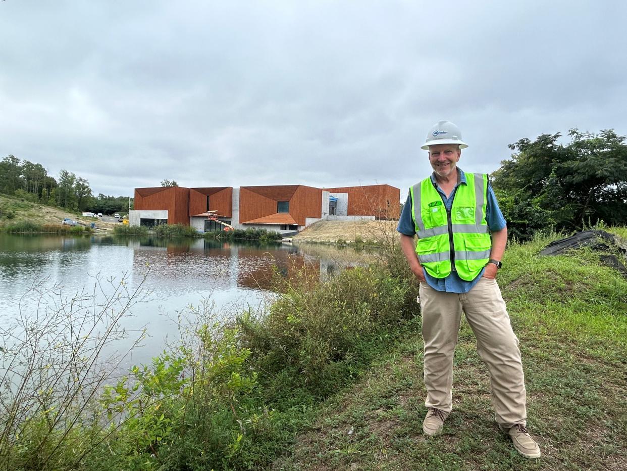 Dr. Ken Lacovara stands outside at the Edelman Fossil Park and Museum, now under construction. Lacovara's discoveries at the site and his ongoing work spurred the creation of the museum, which is expected to open in 2024.