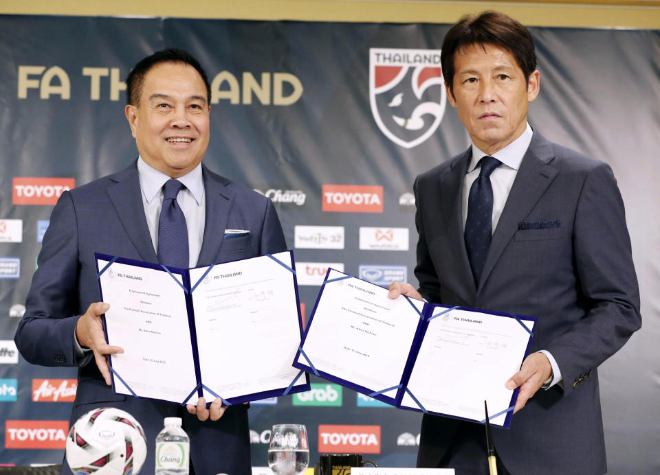 Former Japan manager Akira Nishino, right, and Thai Football Association president Somyot Pumpanmuang attend a press conference in Tokyo, Friday, July 19, 2019. Nishino was officially named head coach of the Thailand national and under-23 men's soccer teams on Wednesday. (Masanobu Kumagai/Kyodo News via AP)