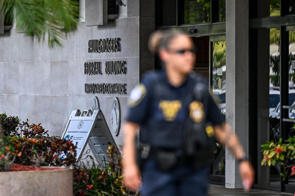Security officers guard the entrance to the federal courthouse in West Palm Beach on Aug. 18, 2022, as the court holds a hearing to determine if the Trump affidavit should be unsealed. <a href="https://media.gettyimages.com/photos/security-officers-guard-the-entrance-to-the-paul-g-rogers-federal-picture-id1242577909?s=2048x2048" rel="nofollow noopener" target="_blank" data-ylk="slk:Chandan Khanna/AFP via Getty Images;elm:context_link;itc:0;sec:content-canvas" class="link ">Chandan Khanna/AFP via Getty Images</a>
