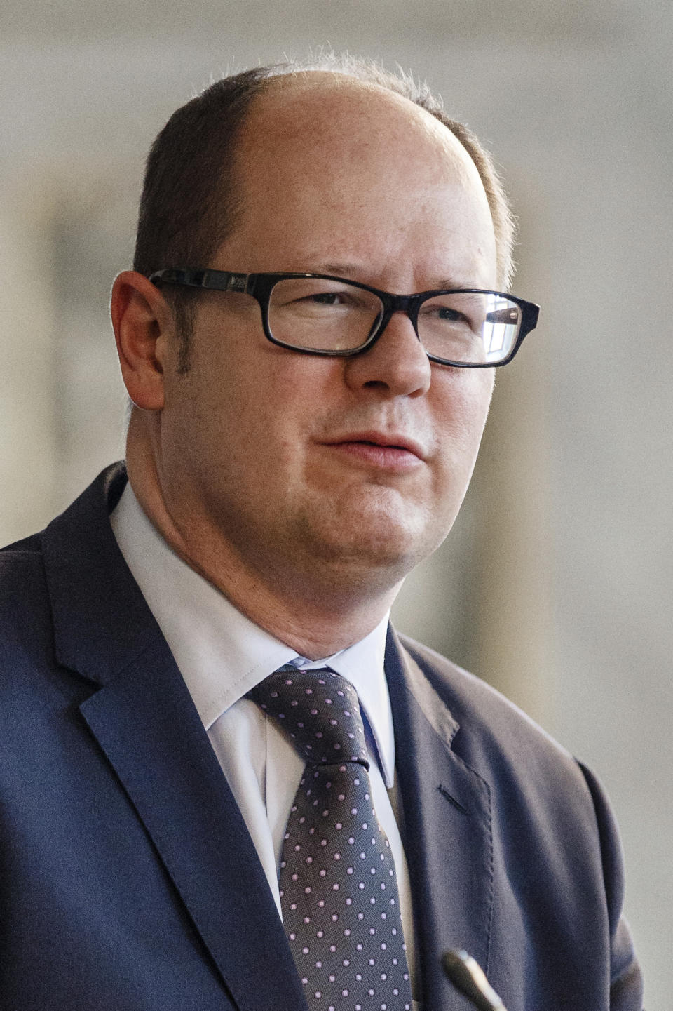 FILE - In this picture taken July 16, 2013 Gdansk Mayor Pawel Adamowicz visits the city hall of Luebeck, northern Germany. (Markus Scholz/dpa via AP)