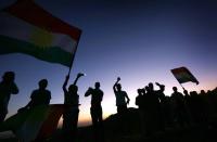 <p>Iraqi Kurds wave Kurdish flags during a gathering on Sept. 10, 2017, to show support for the upcoming independence referendum and encourage people to vote in the town of Akra, roughly 300 miles north of Baghdad. (Photo: Safin Hamed/AFP/Getty Images) </p>