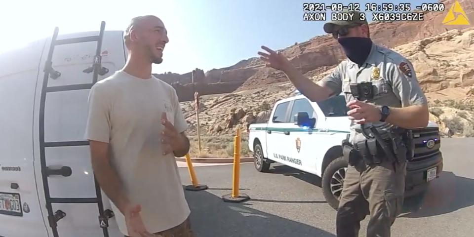 A screenshot from Utah police bodycam footage showing Brian Laundrie talking to a police officer.