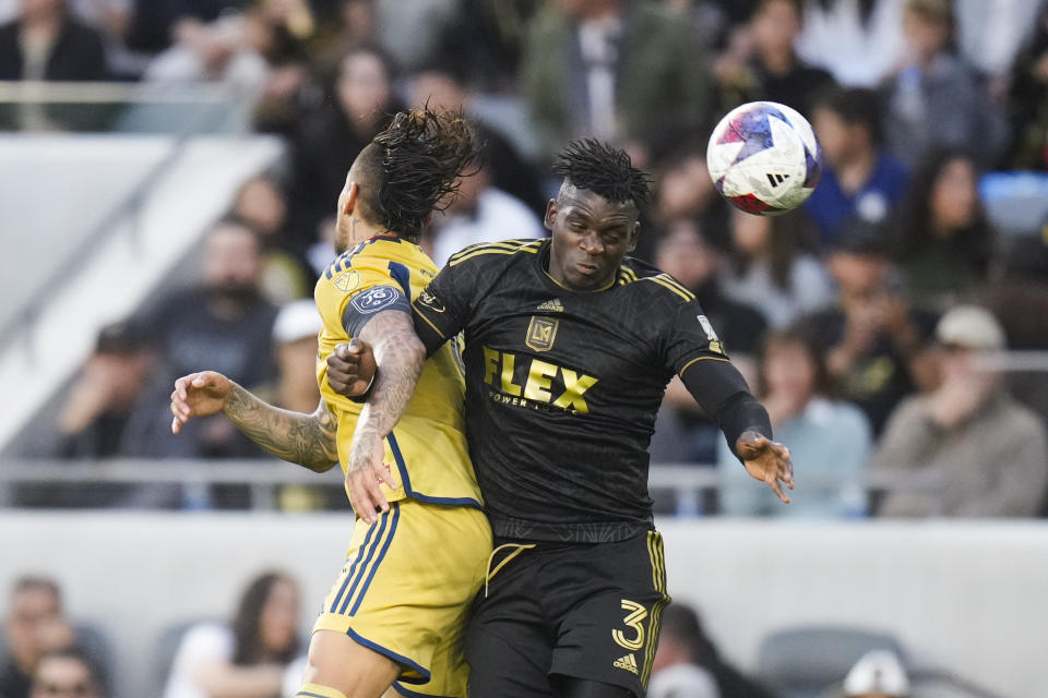 Los Angeles FC defender Jesús Murillo, right, and Real Salt Lake forward Cristian Arango vie for the ball during the first half of an MLS soccer match, Sunday, Oct. 1, 2023, in Los Angeles. (AP Photo/Jae C. Hong)