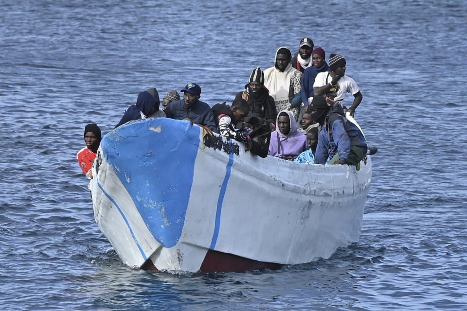 Migrants arrive on a small boat at La Restinga port on the canary island of El Hierro on Sunday Feb. 4, 2024. Spain's marine rescue service says nearly 1,000 migrants from sub-Saharan countries arrived in Spain's Canary Islands in 18 boats in the past three days. The agency says one body was found aboard one of the boats intercepted Monday. (Europa Press via AP) **SPAIN OUT**