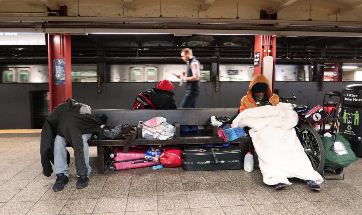 <span class="caption">Homeless people at the 42nd Street and Bryant Park subway station in New York City, March 9, 2020.</span> <span class="attribution"><a class="link " href="https://www.gettyimages.com/detail/news-photo/homeless-people-sleep-in-the-42nd-st-bryant-park-subway-news-photo/1211830073?adppopup=true" rel="nofollow noopener" target="_blank" data-ylk="slk:Gary Hershorn/Corbis via Getty Images;elm:context_link;itc:0;sec:content-canvas">Gary Hershorn/Corbis via Getty Images</a></span>