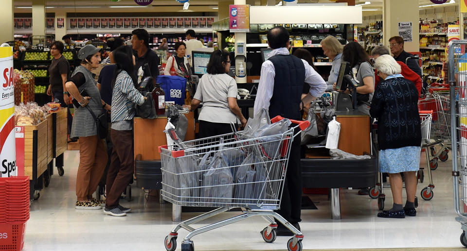 At selected Coles supermarkets shoppers will be unable to use trolleys and it will be baskets only at self-service checkouts as part of a new trial. Image: AAP