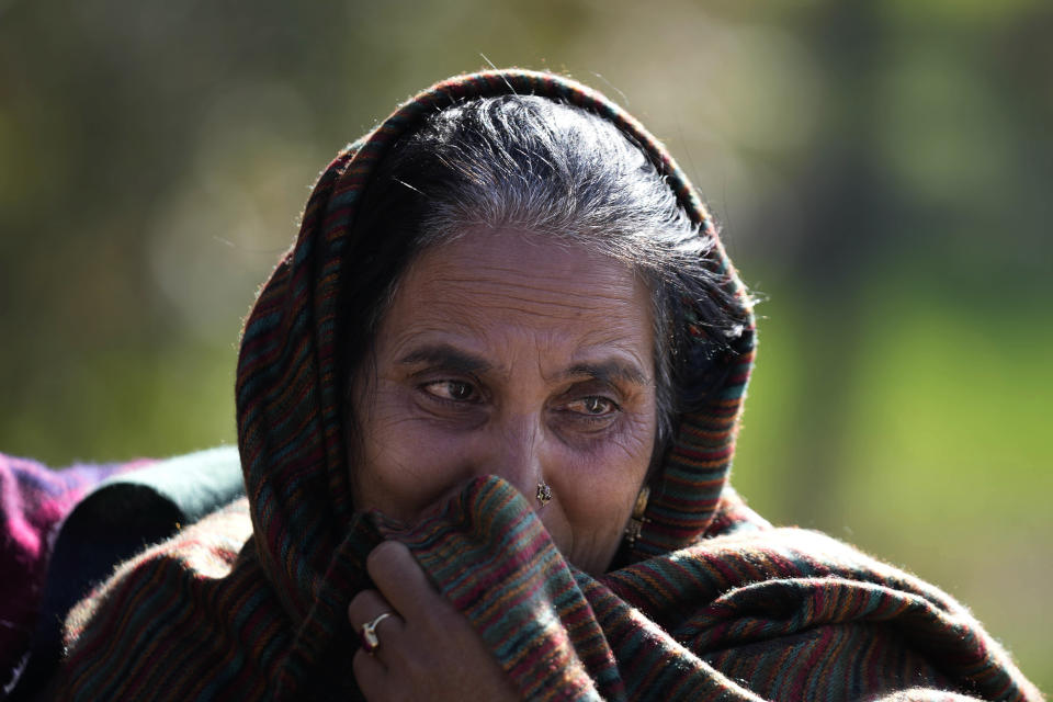 Hindu woman Saroj Bala, whose two sons were killed in early January attacks mourns at Dhangri Village, frontier Rajouri district, Indian controlled Kashmir, Feb. 7, 2023. Days after the deadly violence, Indian authorities revived a government-sponsored militia and began rearming and training thousands of villagers, including some teenagers. The militia, officially called the “Village Defense Group,” was initially formed in the 1990s as the first line of defense against anti-India insurgents in remote villages that government forces could not reach quickly. (AP Photo/Channi Anand)