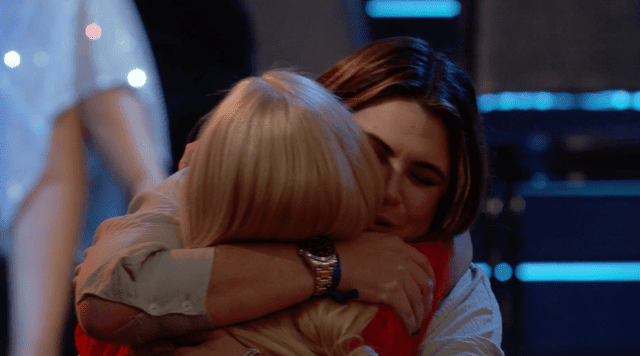 ABC Ellen hugs Roberta's daughter Courtney.