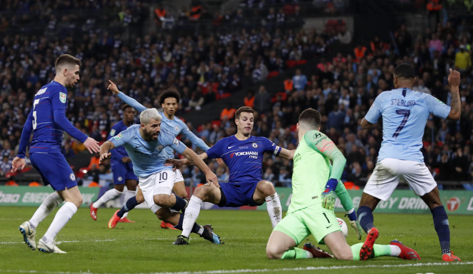 Chelsea goalkeeper Kepa Arrizabalaga, 2nd right, makes a save during the English League Cup final soccer match between Chelsea and Manchester City at Wembley stadium in London, England, Sunday, Feb. 24, 2019. (AP Photo/Alastair Grant)