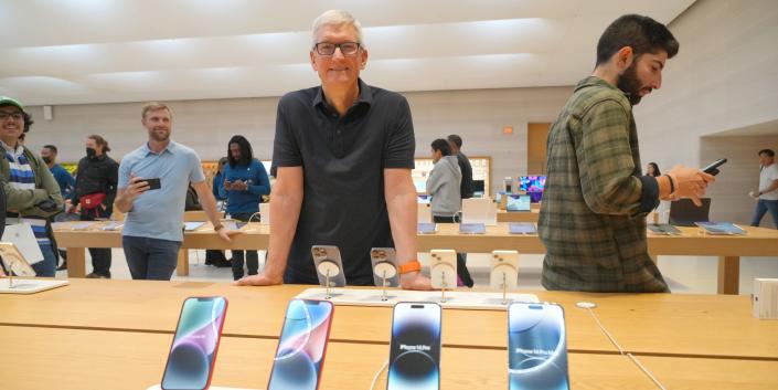Tim Cook visits an Apple store in New York City on September 16.