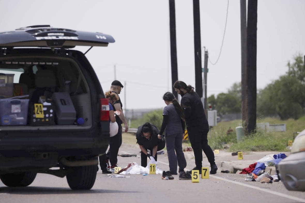 Emergency personnel respond to a fatal collision in Brownsville, Texas, on Sunday, May 7, 2023. (AP Photo/Michael Gonzalez)