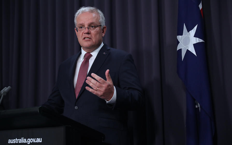 Picture of Scott Morrison addressing reporters, explaining the new federal advise of public gatherings restricted to two people