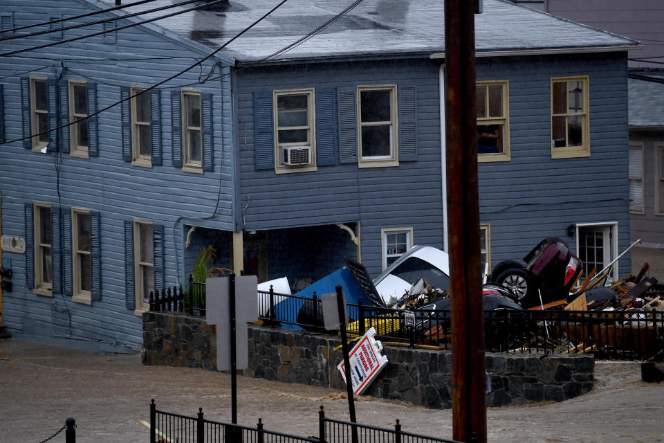 <p>Cars are piled up after a flash flood in the historic downtown May 27, 2018, in Ellicott City, Md. This comes two years after another flash flood devastated the historic downtown. (Photo: Katherine Frey/The Washington Post via Getty Images) </p>