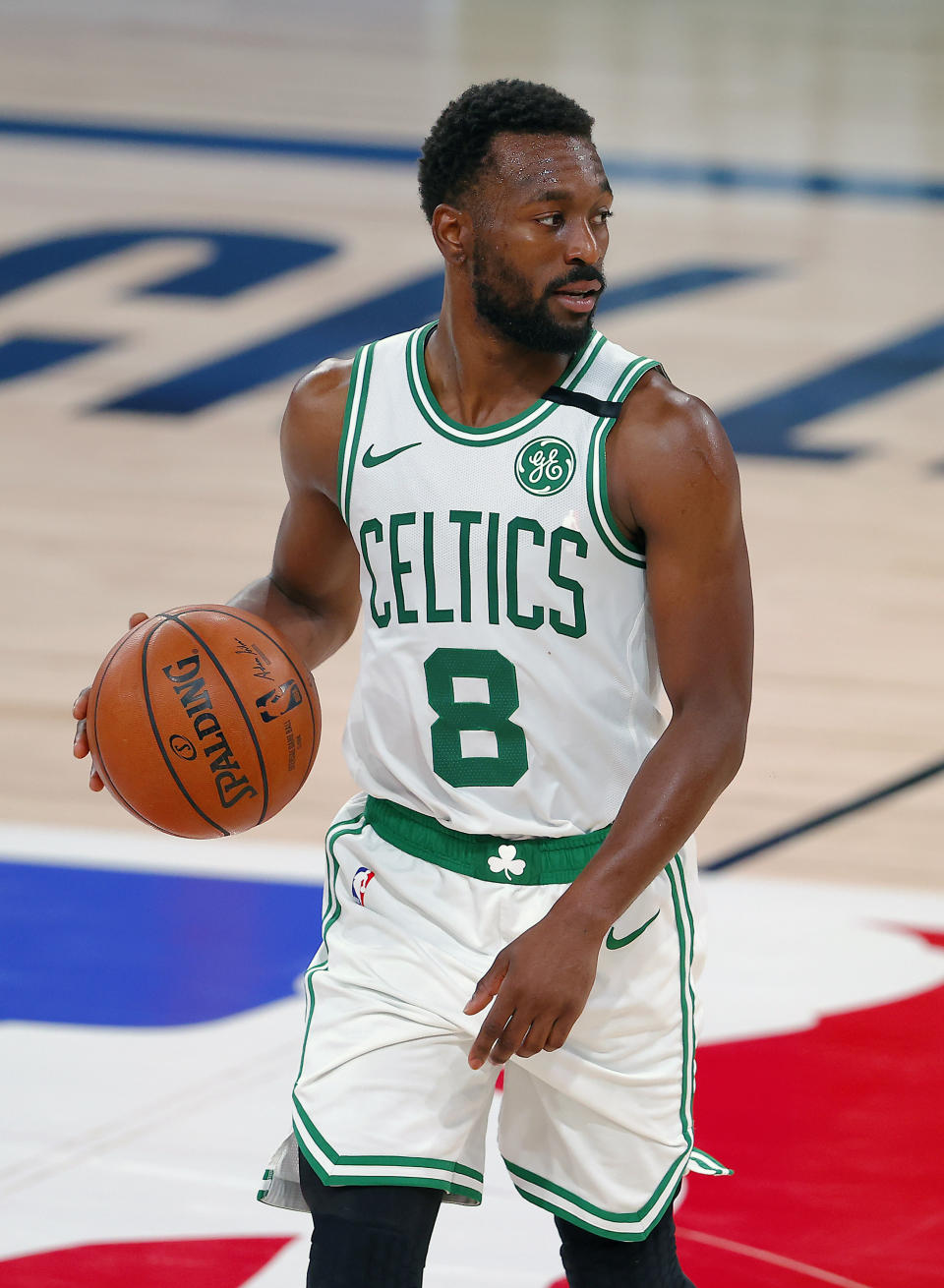 Boston Celtics' Kemba Walker handles the ball during the second half of an NBA basketball game against the Memphis Grizzlies Tuesday, Aug. 11, 2020, in Lake Buena Vista, Fla. (AP Photo/Mike Ehrmann, Pool)