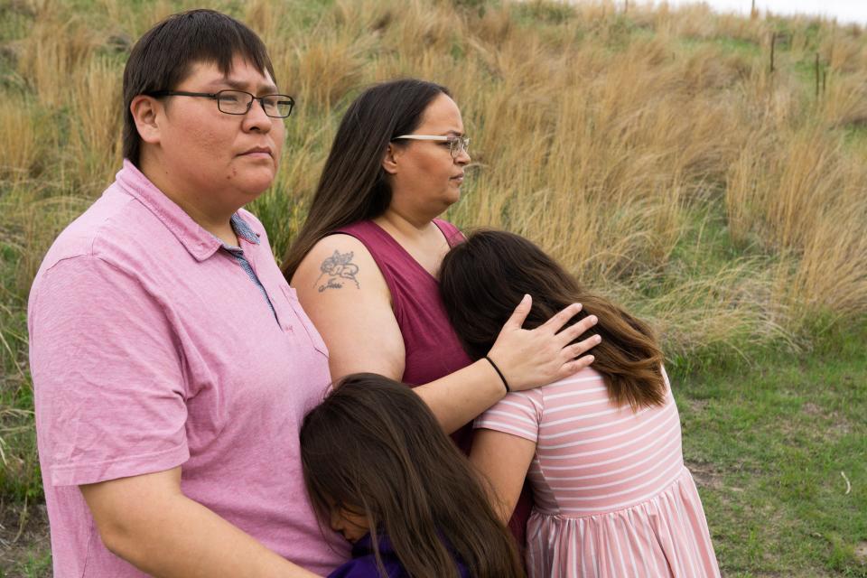 Norma LeRoy, left, and Alice Johnson hold their daughters, ages 7 and 12 in Valentine City Park on May 21. They have filed a lawsuit against Cody-Kilgore Unified Schools, alleging that their daughters' hair was cut in violation of Lakota religious and cultural beliefs and their civil rights.