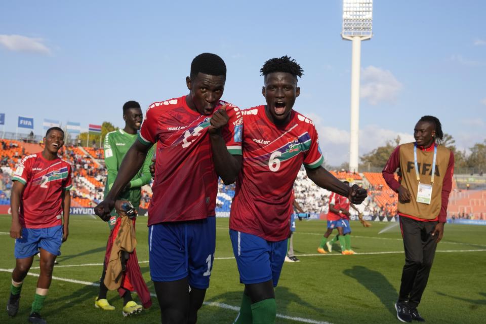 Gambia players celebrate at the end of a FIFA U-20 World Cup Group F soccer match against France at the Malvinas Argentinas stadium in Mendoza, Argentina, Thursday, May 25, 2023. (AP Photo/Natacha Pisarenko)