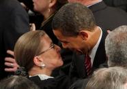 FILE PHOTO: Supreme Court Justice Bader Ginsburg gets a hug from President Obama in Washington