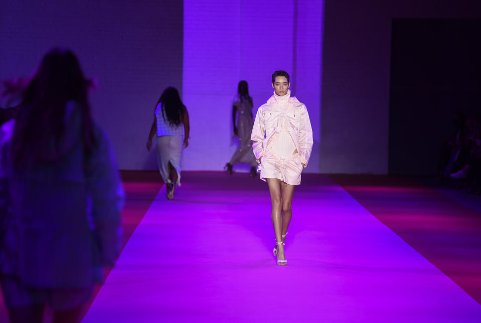 A model walks the runway at the Brandon Maxwell spring/summer 2022 fashion show in the Brooklyn borough of New York during Fashion Week on Friday, Sept. 10, 2021. (Photo by Evan Agostini/Invision/AP)