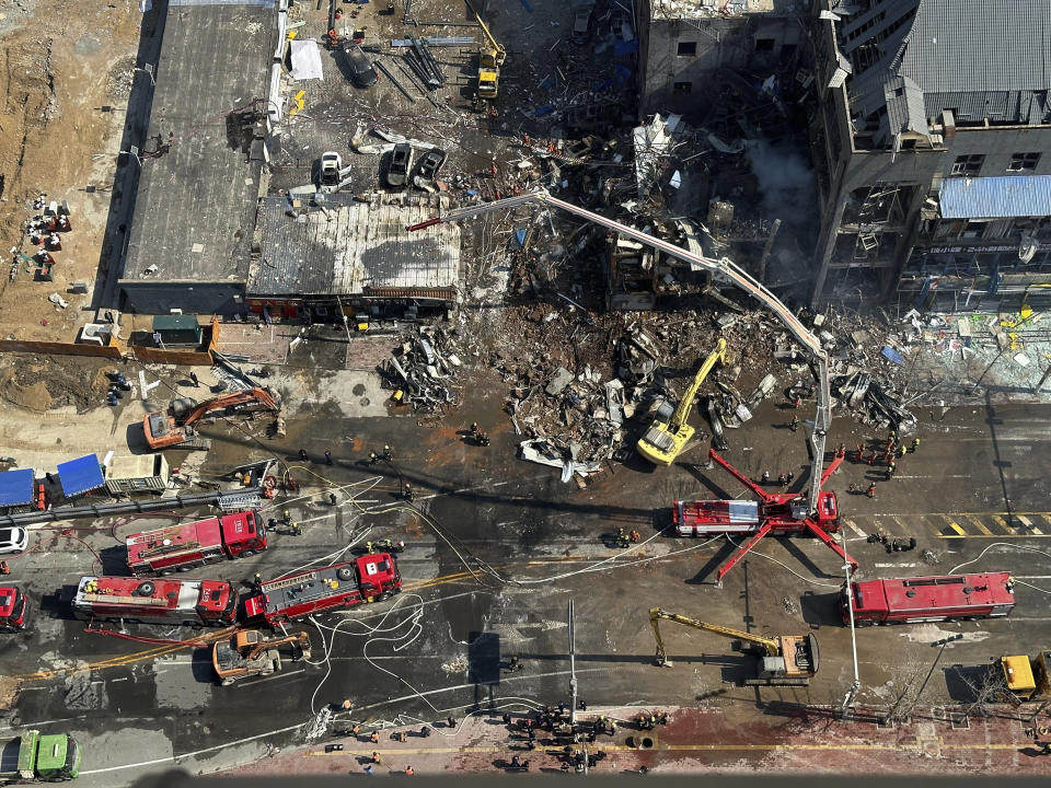 Firefighters work the scene of an explosion in Sanhe city in northern China’s Hebei province on Wednesday, March 13, 2024. Rescuers were responding to a suspected gas leak explosion Wednesday in a building in northern China, authorities said. (AP Photo/Ng Han Guan)